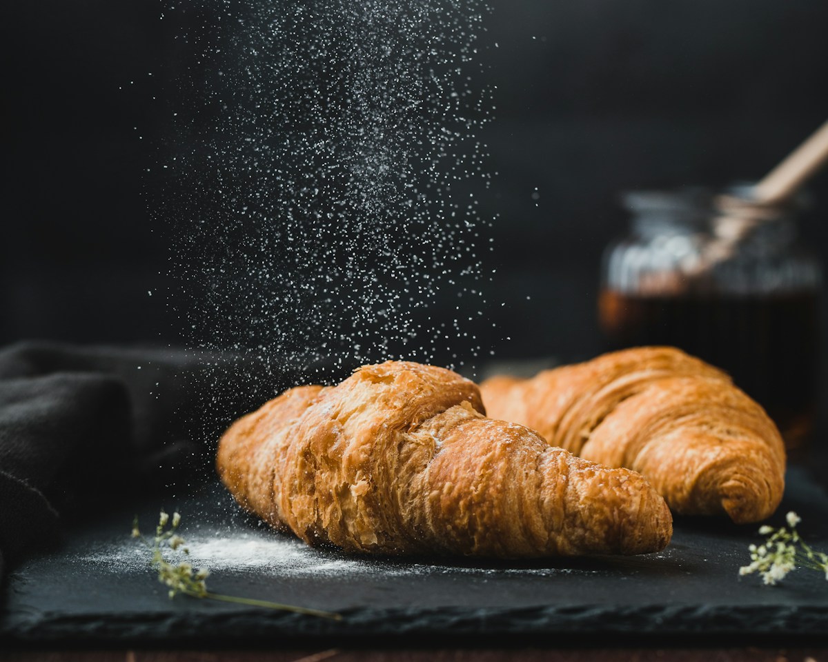 Golden pastry with a dusting of icing sugar